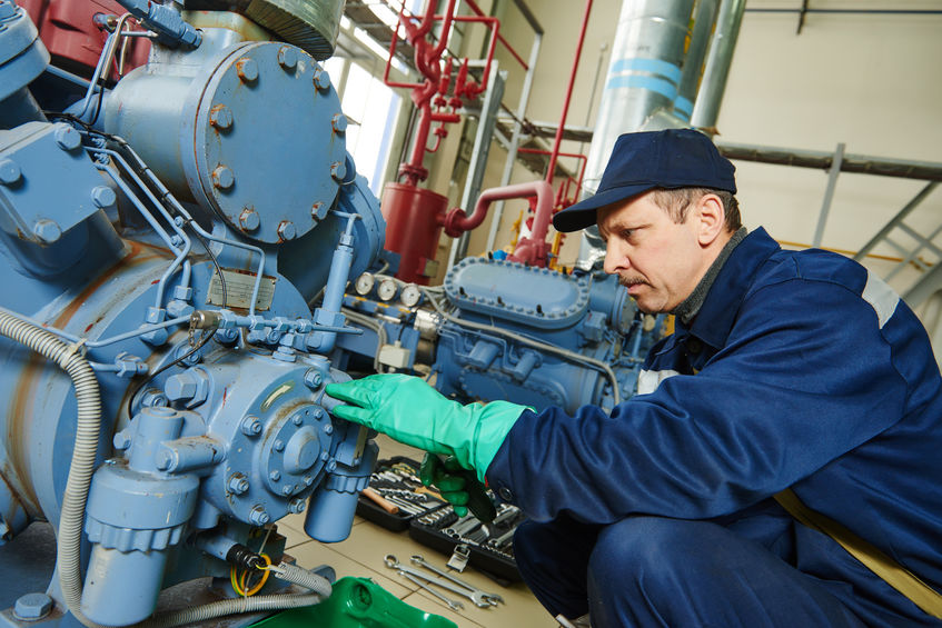 Technician Working on Air Compressor - Compressed Air System Maintenance | AIRPLUS Industrial