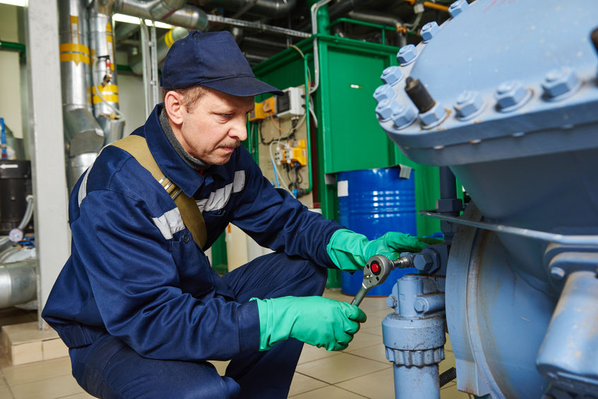 Service Technician Working on Compressor System | AIRPLUS Industrial